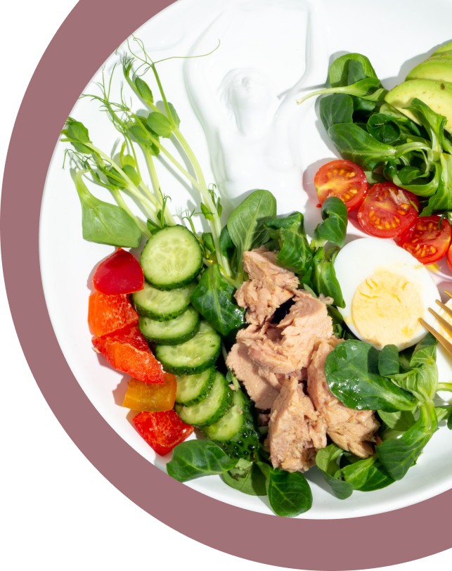 A plate of salad with pineapple and spinach